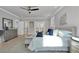 Airy primary bedroom featuring hardwood floors, a ceiling fan, and French doors at 3785 Pilgrim Mill Rd, Cumming, GA 30041