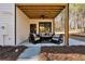 Inviting covered patio with stylish outdoor furniture, ideal for relaxation and entertaining at 3785 Pilgrim Mill Rd, Cumming, GA 30041