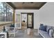 This screened porch has comfortable seating and lovely view of the outdoors at 3785 Pilgrim Mill Rd, Cumming, GA 30041