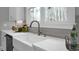 Close-up of kitchen sink area featuring countertops, modern faucet, and stylish decor at 3785 Pilgrim Mill Rd, Cumming, GA 30041