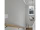 The staircase features a modern chandelier, complementing the neutral wall color and providing natural light at 3785 Pilgrim Mill Rd, Cumming, GA 30041