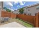 Backyard featuring a wood fence, compact lawn, and concrete patio at 4965 Whiteoak Se Walk # 19, Smyrna, GA 30080