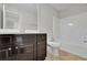 Bathroom with dark vanity, white countertops, toilet, and tub-shower combination at 4965 Whiteoak Se Walk # 19, Smyrna, GA 30080