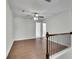 Open landing featuring hardwood floors and a view of the upstairs bedrooms at 4965 Whiteoak Se Walk # 19, Smyrna, GA 30080
