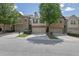 Attractive townhomes featuring a two-car garage, manicured landscaping, and neutral exterior colors at 4965 Whiteoak Se Walk # 19, Smyrna, GA 30080