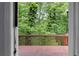 Outdoor view of lush trees, as seen from the back porch of the home at 5029 David Pl, Smyrna, GA 30082