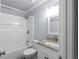 Clean bathroom featuring a bathtub, granite countertop vanity, and a neutral color palette at 5029 David Pl, Smyrna, GA 30082