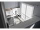 Bright kitchen with white cabinets, granite countertops, stainless steel appliances, and a view from above at 5029 David Pl, Smyrna, GA 30082
