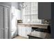 Charming kitchen featuring white cabinets, granite countertops, and stainless steel appliances, bathed in natural light at 5029 David Pl, Smyrna, GA 30082
