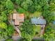 Aerial view of a home surrounded by lush trees and green landscaping at 1997 N Landing Way, Marietta, GA 30066