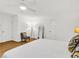 Bright bedroom featuring hardwood floors, a ceiling fan, and neutral decor at 1997 N Landing Way, Marietta, GA 30066