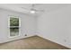 Bedroom features natural light, neutral walls and carpeting and a ceiling fan at 1997 N Landing Way, Marietta, GA 30066