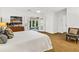 Cozy bedroom boasts hardwood floors, natural light, and access to an outdoor area at 1997 N Landing Way, Marietta, GA 30066