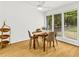 Inviting dining room with large windows, a modern light fixture, and seating for four at 1997 N Landing Way, Marietta, GA 30066