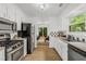 Efficient kitchen featuring sleek stainless steel appliances and bright white cabinetry at 1997 N Landing Way, Marietta, GA 30066