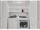 Laundry room features new washer and dryer and shelving for storage at 1997 N Landing Way, Marietta, GA 30066