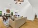 Bright and airy living room features a stone fireplace, ceiling fan, and light hardwood floors at 1997 N Landing Way, Marietta, GA 30066