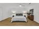 Main bedroom featuring hardwood floors, a bed, lamps, and dresser at 1997 N Landing Way, Marietta, GA 30066