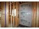Bathroom's framed interior showcases essential plumbing lines and DryLine weather barrier on walls at 4720 Briscoe Dr, Cumming, GA 30028