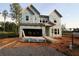 Unfinished two-story home with a two-car garage, showcasing its structure under construction at 4720 Briscoe Dr, Cumming, GA 30028