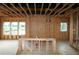 Open interior space showing the wooden framing and windows, highlighting the home's structural design at 4720 Briscoe Dr, Cumming, GA 30028