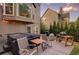 Back patio featuring a hot tub, grill, and outdoor dining area for relaxation and entertainment at 5028 Winding Hills Ln, Woodstock, GA 30189
