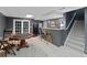 Finished basement with a bar, game table and stairs leading to the upper level at 5028 Winding Hills Ln, Woodstock, GA 30189