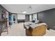 Finished basement with tile flooring, gray walls, and projector screen at 5028 Winding Hills Ln, Woodstock, GA 30189