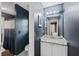 Contemporary bathroom with gray walls, granite countertop, and dark blue shower curtain at 5028 Winding Hills Ln, Woodstock, GA 30189