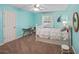 Bedroom with neutral carpet, accent walls, and a door to the hallway at 5028 Winding Hills Ln, Woodstock, GA 30189