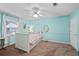 Bedroom has neutral carpet flooring and is brightly lit with an accent wall at 5028 Winding Hills Ln, Woodstock, GA 30189