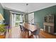 Stylish dining room with a large window, hardwood floors, and modern decor at 5028 Winding Hills Ln, Woodstock, GA 30189