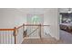 Bright hallway view with staircase, chandelier, and bedroom in the background at 5028 Winding Hills Ln, Woodstock, GA 30189