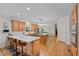 Bright kitchen with wooden cabinets, a large island, stainless appliances, and eat-in area at 5028 Winding Hills Ln, Woodstock, GA 30189