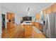 Bright open kitchen with stainless steel appliances, island, and view of the living room at 5028 Winding Hills Ln, Woodstock, GA 30189
