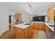 Bright open kitchen with stainless steel appliances, island, and view of the living room at 5028 Winding Hills Ln, Woodstock, GA 30189
