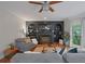 Bright living room features built-in shelving, a ceiling fan, and hardwood floors at 5028 Winding Hills Ln, Woodstock, GA 30189