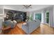 Inviting living room boasts a decorative fireplace, custom built-ins, and hardwood flooring at 5028 Winding Hills Ln, Woodstock, GA 30189