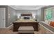 Main bedroom features tray ceiling, window seat, and neutral carpet flooring at 5028 Winding Hills Ln, Woodstock, GA 30189