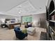 Spacious main bedroom features a sitting area, tray ceiling, and neutral decor at 5028 Winding Hills Ln, Woodstock, GA 30189