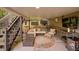 Covered patio featuring a comfortable seating area and mounted TV at 5028 Winding Hills Ln, Woodstock, GA 30189