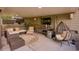 Covered patio featuring a comfortable seating area and mounted TV at 5028 Winding Hills Ln, Woodstock, GA 30189