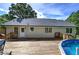 Exterior view of the home's backyard with a deck and pool at 527 Cass White Nw Rd, Cartersville, GA 30121