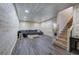 Basement with wood-paneled walls, laminate floors, and comfortable sectional couch at 527 Cass White Nw Rd, Cartersville, GA 30121
