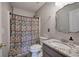 Stylish bathroom with patterned shower curtain, granite countertop, and a modern sink at 527 Cass White Nw Rd, Cartersville, GA 30121