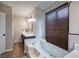 Bright bathroom featuring tub, large window with blinds, and white countertops at 527 Cass White Nw Rd, Cartersville, GA 30121