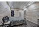 Bedroom featuring wood-paneled walls, laminate floors, and closet area at 527 Cass White Nw Rd, Cartersville, GA 30121