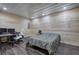 Bedroom featuring wood-paneled walls, laminate floors, and desk area at 527 Cass White Nw Rd, Cartersville, GA 30121