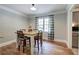 Charming dining area with hardwood floors, a rustic table, and ample natural light at 527 Cass White Nw Rd, Cartersville, GA 30121