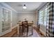 Bright dining area with hardwood floors, french doors, and a cozy table setting at 527 Cass White Nw Rd, Cartersville, GA 30121